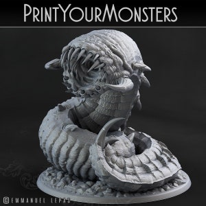 May include: A gray 3D printed miniature of a monstrous creature with a large, gaping mouth and a segmented body. The creature is curled up in a defensive posture, with its head tucked into its body. The miniature is designed for tabletop gaming or display.