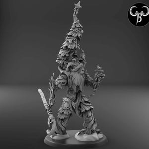 May include: A gray, detailed miniature figurine of a creature with a beard and a Christmas tree growing from its head. The creature is standing on a base with snow.