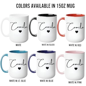 May include: Six 15oz ceramic mugs with the name Camila and a heart printed in black script. The mugs feature white exteriors with various colored handles and interiors, including solid white, black, red, light blue, dark blue, and pink options.