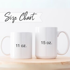 May include: Two white ceramic mugs with black text. The smaller mug is 11 oz and the larger mug is 15 oz.