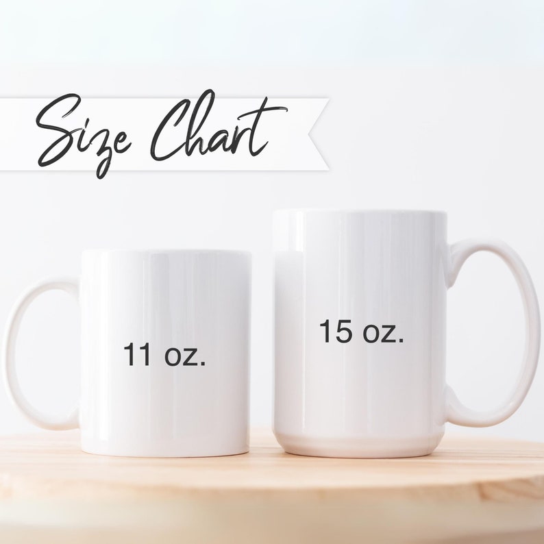 May include: Two white ceramic mugs with black text. The smaller mug is 11 oz and the larger mug is 15 oz.
