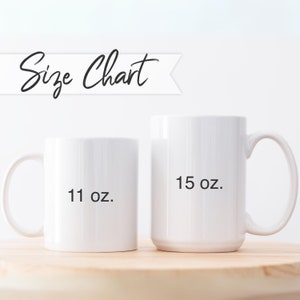 May include: Two white ceramic mugs with black text. The smaller mug is 11 oz and the larger mug is 15 oz.