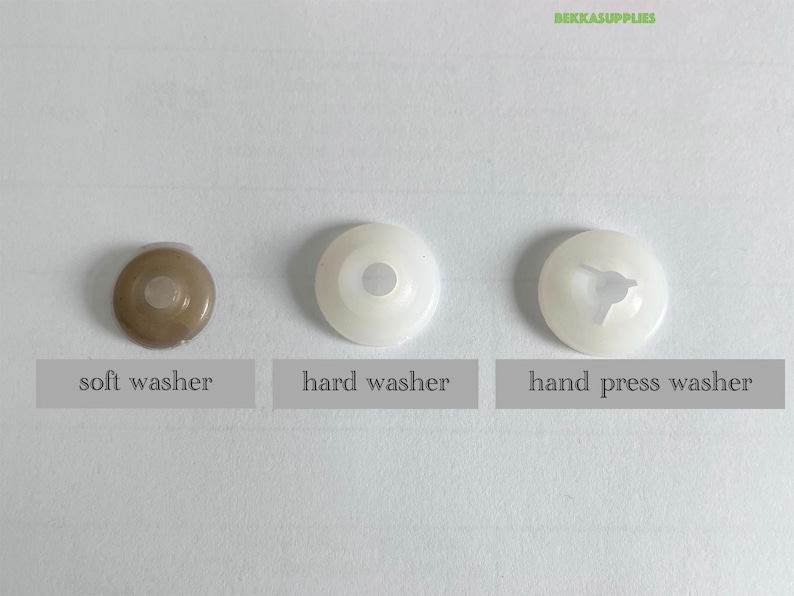 May include: Three plastic washers, one brown, one white, and one white with a hand press design. The washers are labeled "soft washer", "hard washer", and "hand press washer".