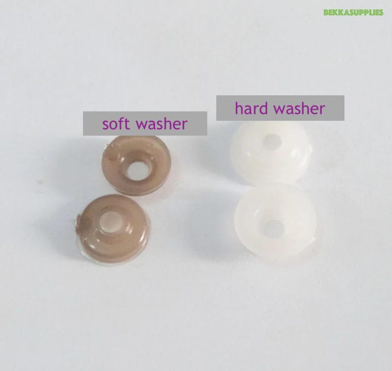 May include: Two soft brown rubber washers and two hard white plastic washers. The washers are used for sewing projects.