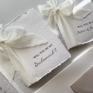 May include: A rustic wooden sign with the text "Welcome to our home" in white lettering. The sign features a distressed finish and a simple, inviting design, perfect for entryway decor.