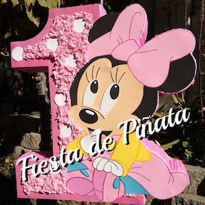 Baby Minnie pinata with optional numer 1 threw 9 aviable.