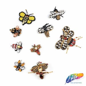 May include: Assortment of ten beaded bee embellishments in various colors, including black, gold, red, yellow, and clear. The bees are decorated with rhinestones and beads.