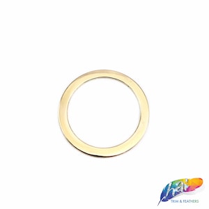 May include: A gold-colored metal ring, approximately 1 inch in diameter, with a smooth, rounded edge.