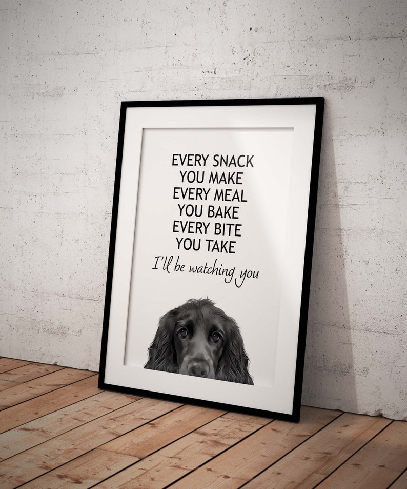 May include: A black and white printable wall art print with a black dog's head peeking out from the bottom of the frame. The text reads "Every snack you make, every meal you bake, every bite you take, I'll be watching you."