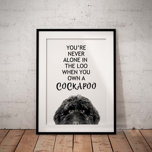 May include: Black and white printable wall art featuring a Cockapoo dog with the text "You're never alone in the loo when you own a Cockapoo".
