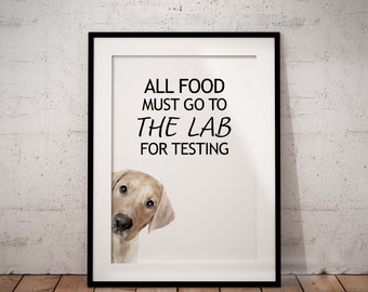 May include: A white framed print with a black and white illustration of a dog peeking around the corner. The text on the print reads "All food must go to the lab for testing."
