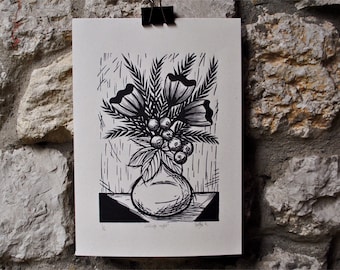 May include: Black and white woodcut print of a vase with flowers and berries. The print is titled "Midsummer Night" and signed by the artist.