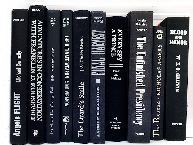 May include: A collection of ten black hardcover books with white lettering on the spines. The titles include "Adventures in Conservation with Franklin D. Roosevelt", "The Ultimate Weapon is No Weapon", "The Lizard's Smile", "Final Harvest", "Every Spy a Prince", "The Unfinished Presidency", "The Rescue", and "Blood and Honor".