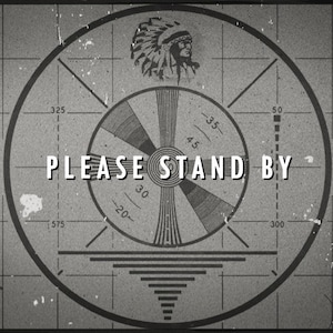 May include: A black and white vintage television test pattern with a Native American headdress in the center. The text "PLEASE STAND BY" is displayed below the headdress.