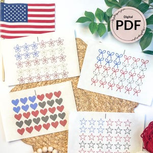 May include: Four cards with patriotic designs: flowers, bows, hearts, and stars in red, white, and blue. An American flag and the words "Digital PDF" are also visible. The cards are on a woven mat.