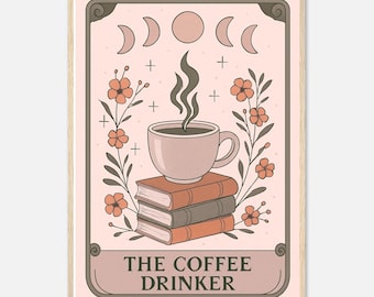 May include: A framed art print featuring a coffee cup atop a stack of books, surrounded by floral and celestial elements. The text "THE COFFEE DRINKER" is displayed at the bottom. The color palette includes shades of pink, brown, and beige.