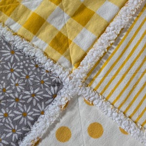 All flannel rag quilt. Gray, white and yellow. Super soft and snuggly!
