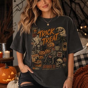 Halloween t-shirt mockup on a woman wearing a relaxed oversized tee with retro pumpkins, skulls, ghost, moon and Trick or Treat design.