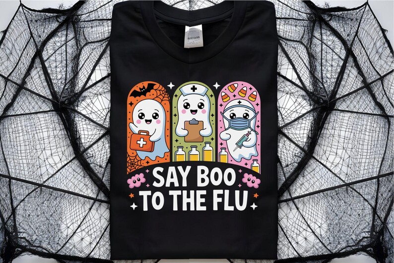 May include: Black t-shirt with a Halloween-themed graphic. The design features three cartoon ghosts, each in a different medical role, with the text "SAY BOO TO THE FLU." The ghosts are set against a backdrop of a spider web.
