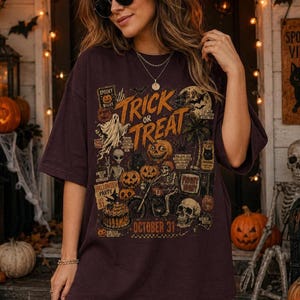 Woman modeling a large Halloween t-shirt with distressed retro Trick or Treat artwork, jack o lanterns, skull, skeleton and spooky night details.