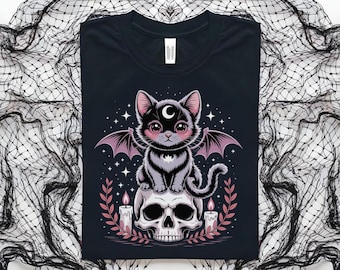 Spooky Cute Bat Cat Halloween T-Shirt – Gothic Witchy Cat on Skull Shirt – Pastel Goth Aesthetic Tee – Creepy Cute Halloween Graphic Tee
