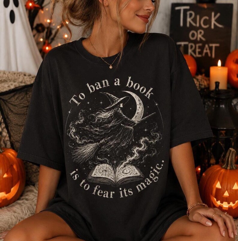 Dark academia Halloween graphic featuring a witch flying above an open book with stars, moon and magical smoke details.