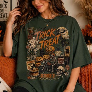 Oversized Halloween shirt mockup featuring a vintage orange and cream Trick or Treat design with pumpkins, ghosts, skeletons and full moon.