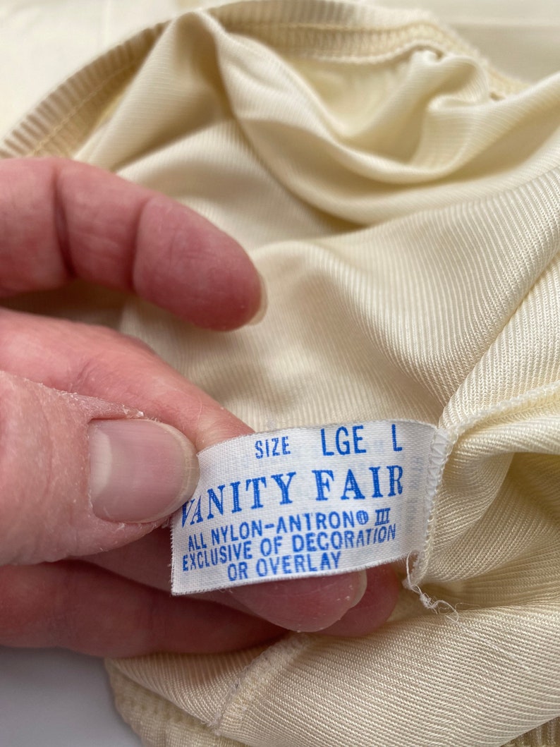 Brand new Vanity Fair Cream Camisole and Half Slip.