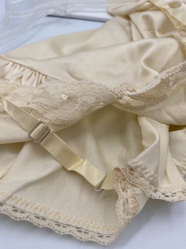 Brand new Vanity Fair Cream Camisole and Half Slip.