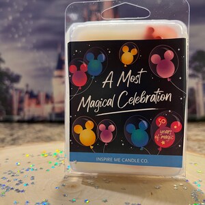May include: A white wax melt in a clear plastic container with a black label that says "A Most Magical Celebration" with Mickey Mouse heads in colorful balloons. The label also says "50 years of magic" and "Inspire Me Candle Co."