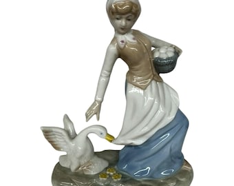 1980 Enesco Fine Porcelain Lady Carrying Eggs with Goose Tugging at Dress
