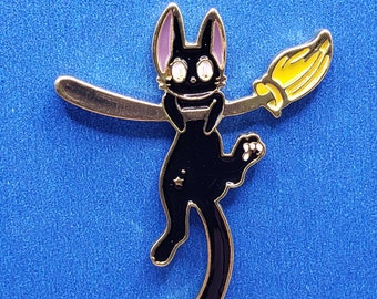 Black Cat  Pin / Jiji hanging from a  broom stick ?