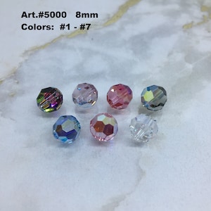 May include: Seven 8mm faceted glass beads in various colors, including iridescent, pink, blue, and clear. Art. #5000 Colors: #1 - #7