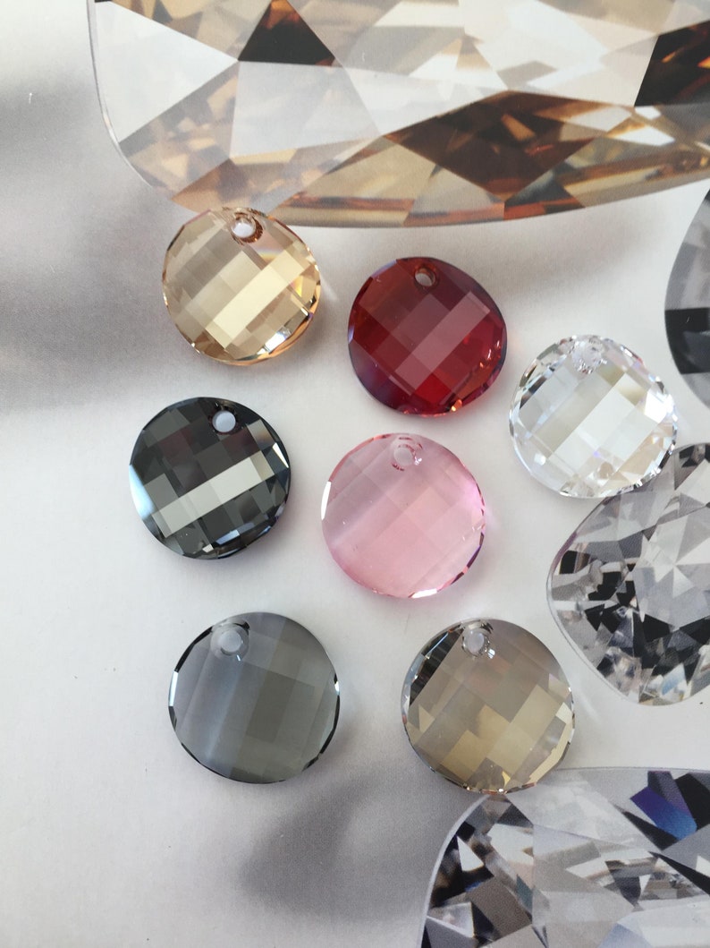 May include: Assortment of round crystal beads with a hole for stringing. The beads are in various colors, including clear, black, red, pink, and brown.