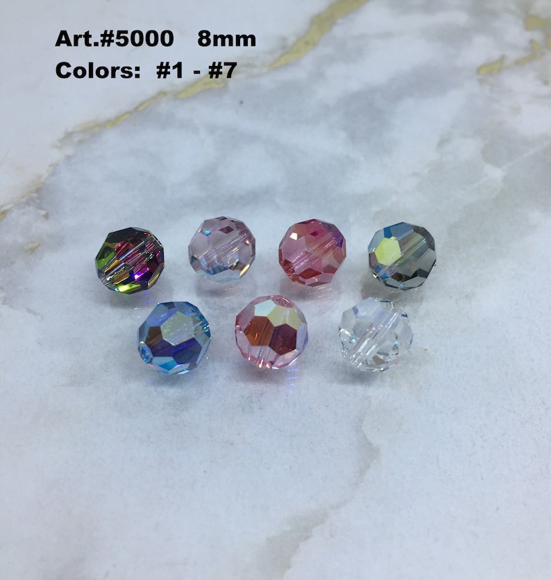 Peut inclure: Sept perles en verre facett&eacute;es de 8 mm dans diff&eacute;rentes couleurs, y compris iris&eacute;, rose, bleu et transparent. Art. #5000 Couleurs : #1 - #7