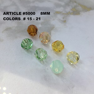 Peut inclure: Huit perles en verre de 8 mm de différentes couleurs, notamment vert, jaune, orange et transparent. ARTICLE #5000 COULEURS # 15 - 21