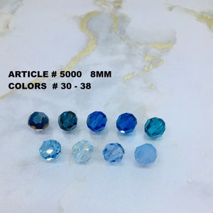 May include: Eight 8mm round glass beads in various shades of blue.  ARTICLE # 5000 COLORS # 30 - 38