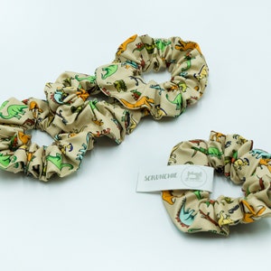 Decorative hair scrunchie in original Dinosaur design