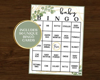 Puede incluir: Una tarjeta de bingo de baby shower verde y dorada con las palabras "baby bingo" en la parte superior. La tarjeta tiene un espacio libre en el centro y está rodeada de un marco geométrico dorado. La tarjeta incluye palabras como "bolsa de pañales", "monitor de bebé", "silla alta", "fórmula", "animal de peluche", "toallitas", "manta", "asiento de coche", "bañera de bebé", "polvo de bebé", "mono", "puerta de bebé", "mordedor", "cuna", "canción de cuna", "sonajero", "pato de goma", "babero", "biberón", "cochecito" y "loción para bebé".