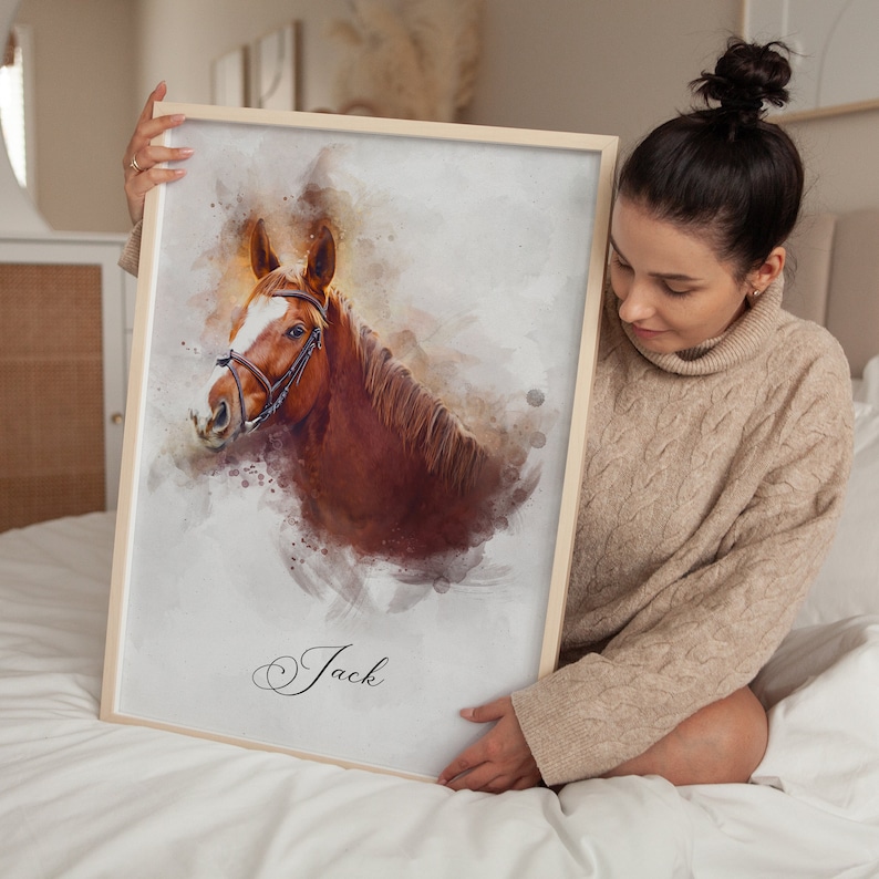 May include: A watercolor painting of a brown horse with a bridle, set against a white background with a light brown watercolor wash. The horse's name, "Jack", is written in cursive at the bottom of the painting.