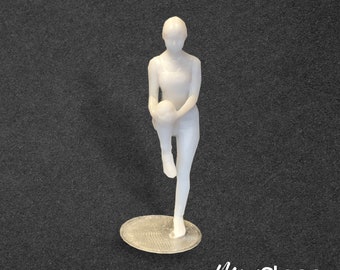 Darcy - a Scale Model Box Unpainted Figure of Woman Standing in Sports Clothing Stretching