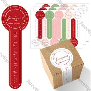 May include: A selection of stickers and a small cardboard box. The stickers display the text "Thank you! Happy Every Day" and "Welcome to your next purchase. Have a pleasant day." The stickers are red, green, and pink.