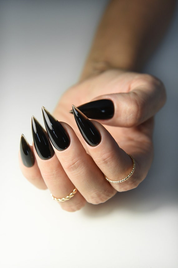 Dark and edgy stiletto nails with black and green drip design on Craiyon