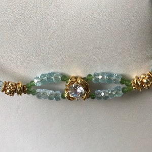 Blue green Aquamarine gemstone beaded bracelet with a brilliant cut round CZ accent. Genuine aquamarine March birthday gift