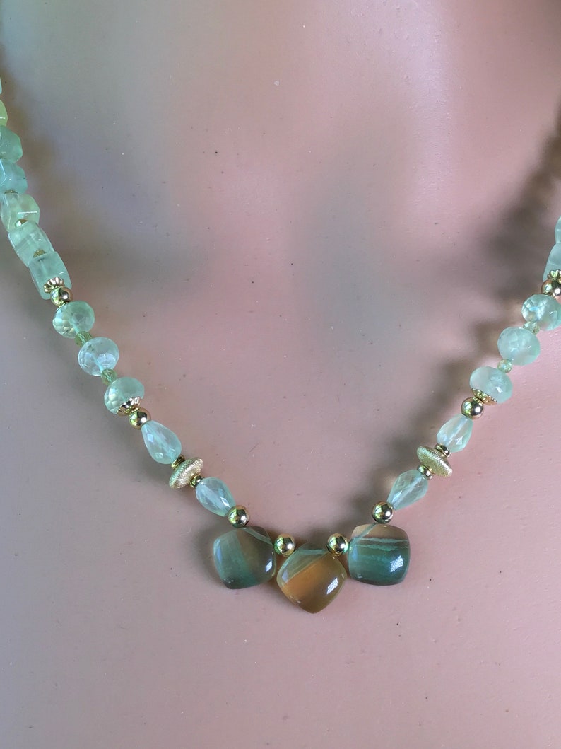 Lemon lime gemstones beaded necklace. Rainbow Gold and green fluorite pendant on a beaded strand of green prehinite