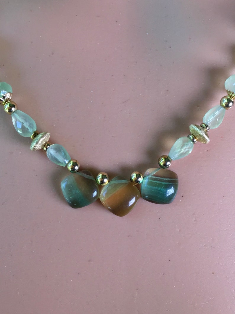 Lemon lime gemstones beaded necklace. Rainbow Gold and green fluorite pendant on a beaded strand of green prehinite