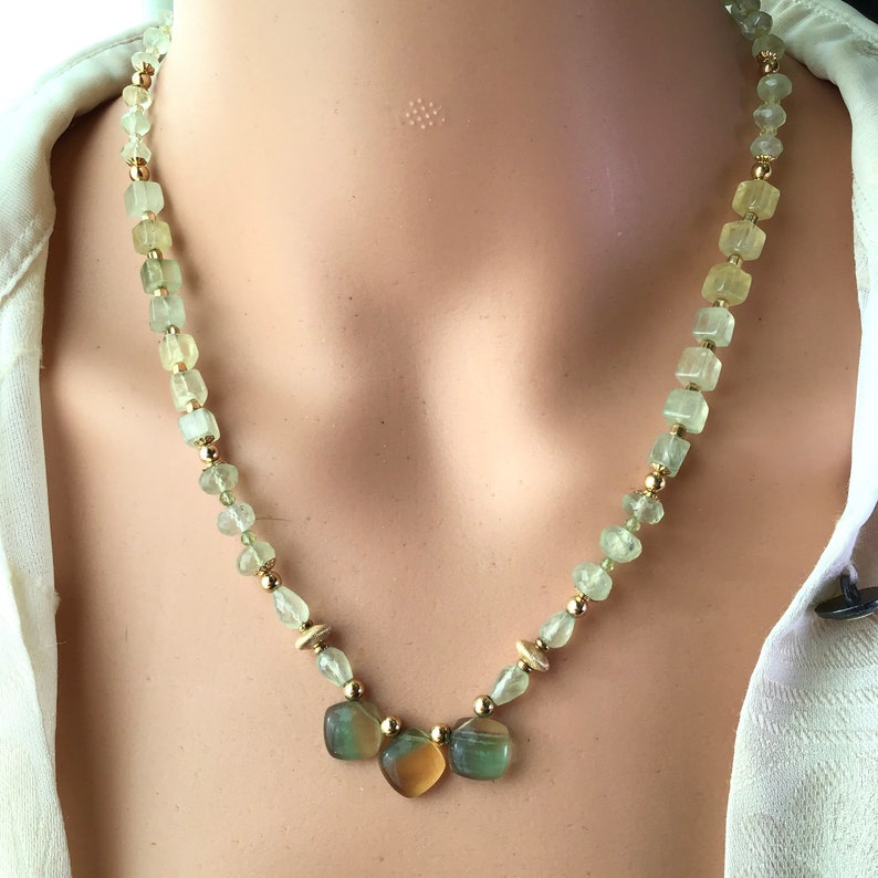 Lemon lime gemstones beaded necklace. Rainbow Gold and green fluorite pendant on a beaded strand of green prehinite