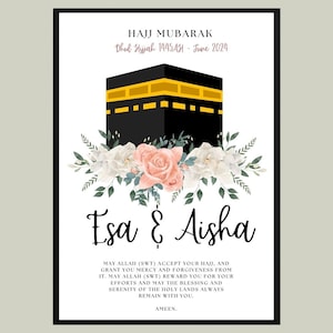 May include: A white card with black text and a black and gold illustration of the Kaaba. The text reads "Hajj Mubarak Dhul Hijjah 1445AH - June 2024 Esa & Aisha May Allah (SWT) accept your Hajj, and grant you mercy and forgiveness from it. May Allah (SWT) reward you for your efforts and may the blessing and serenity of the holy lands always remain with you. Ameen."