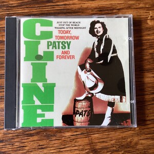Peut inclure: Un boîtier de CD vert et blanc avec une photo de Patsy Cline sur le devant. Le texte sur le boîtier indique "Just out of reach, Stop the world, Walking after midnight, Today, Tomorrow, Patsy, And Forever".