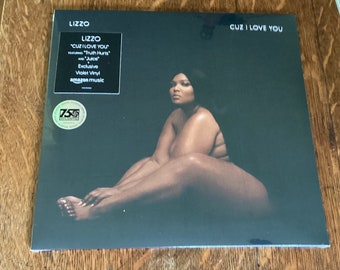 May include: A vinyl record album titled "Cuz I Love You" by Lizzo. The album cover features a dark background with Lizzo in a seated pose. The album includes the songs "Truth Hurts" and "Juice".